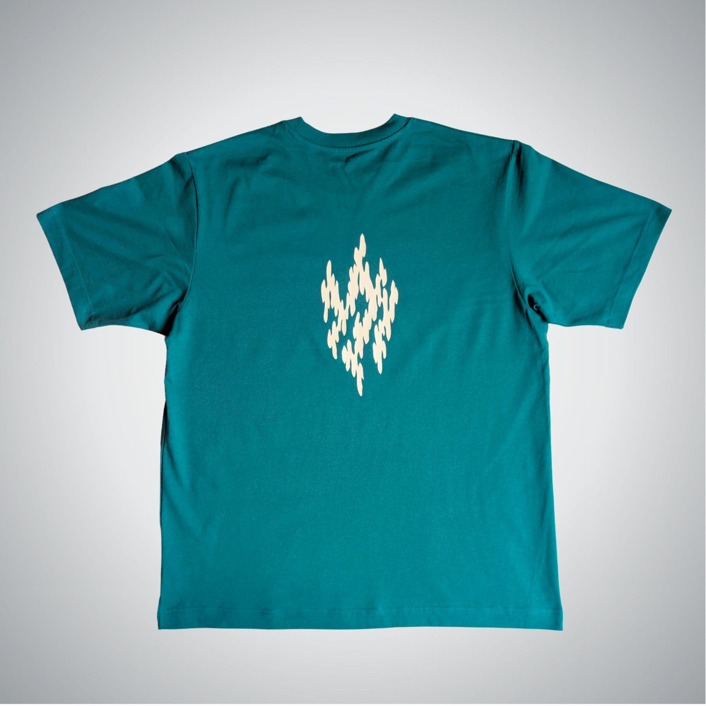 Teal t-shirt with a white geometric design on a gray background