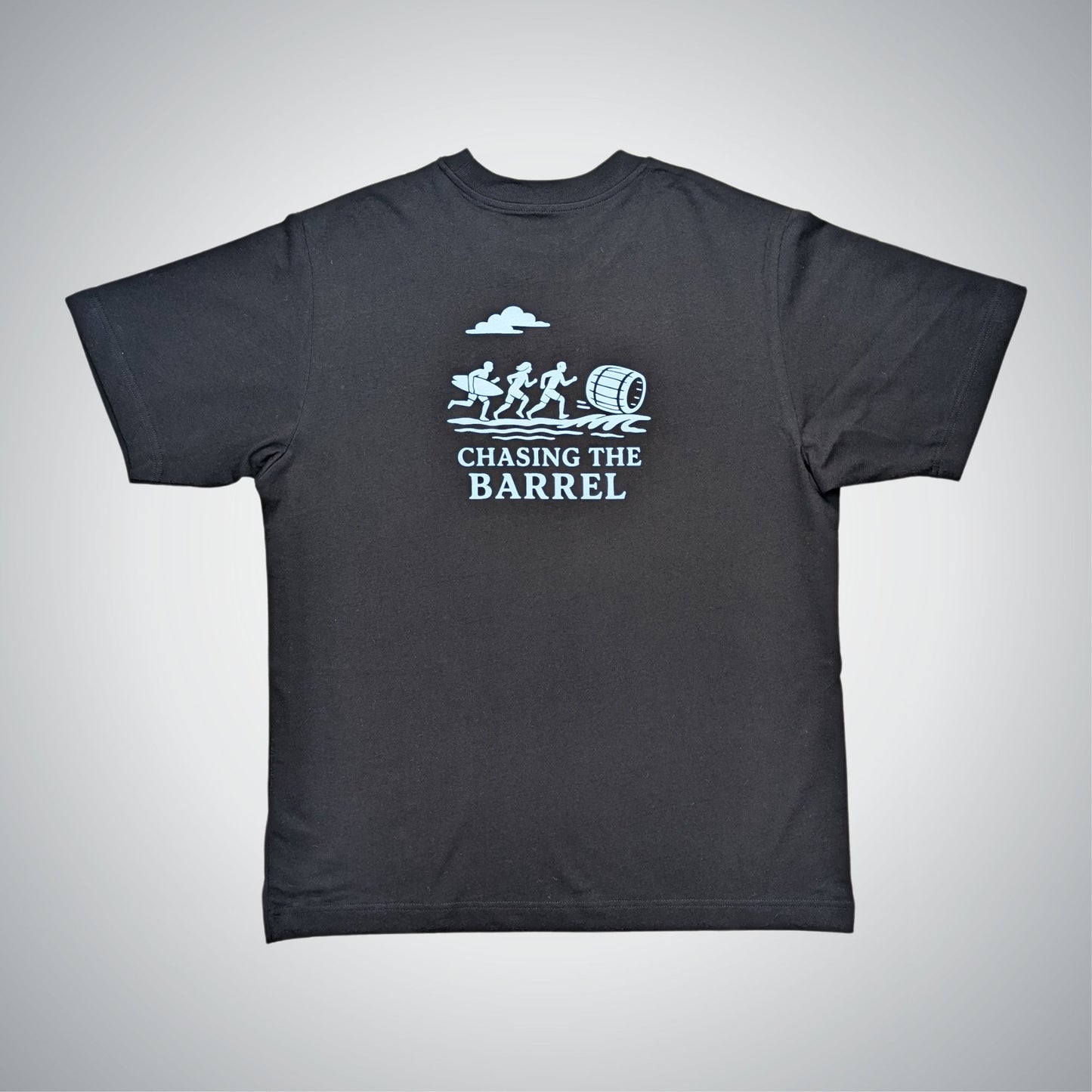 Black t-shirt with 'Chasing the Barrel' graphic design on a gray background