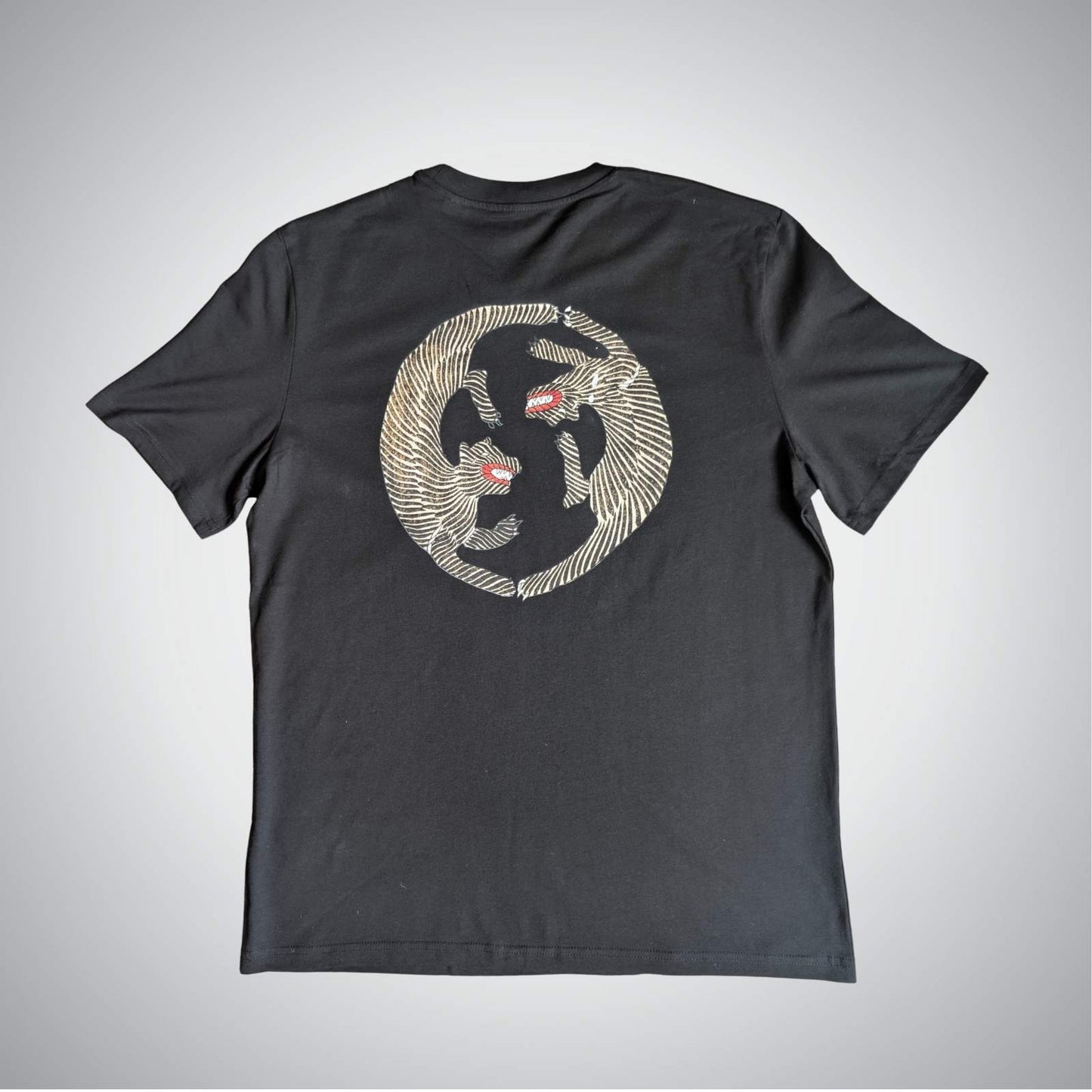 Black t-shirt with a graphic design on a gray background