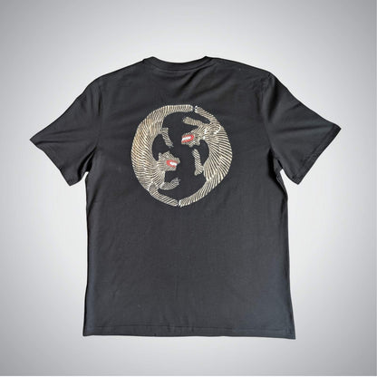 Black t-shirt with a graphic design on a gray background