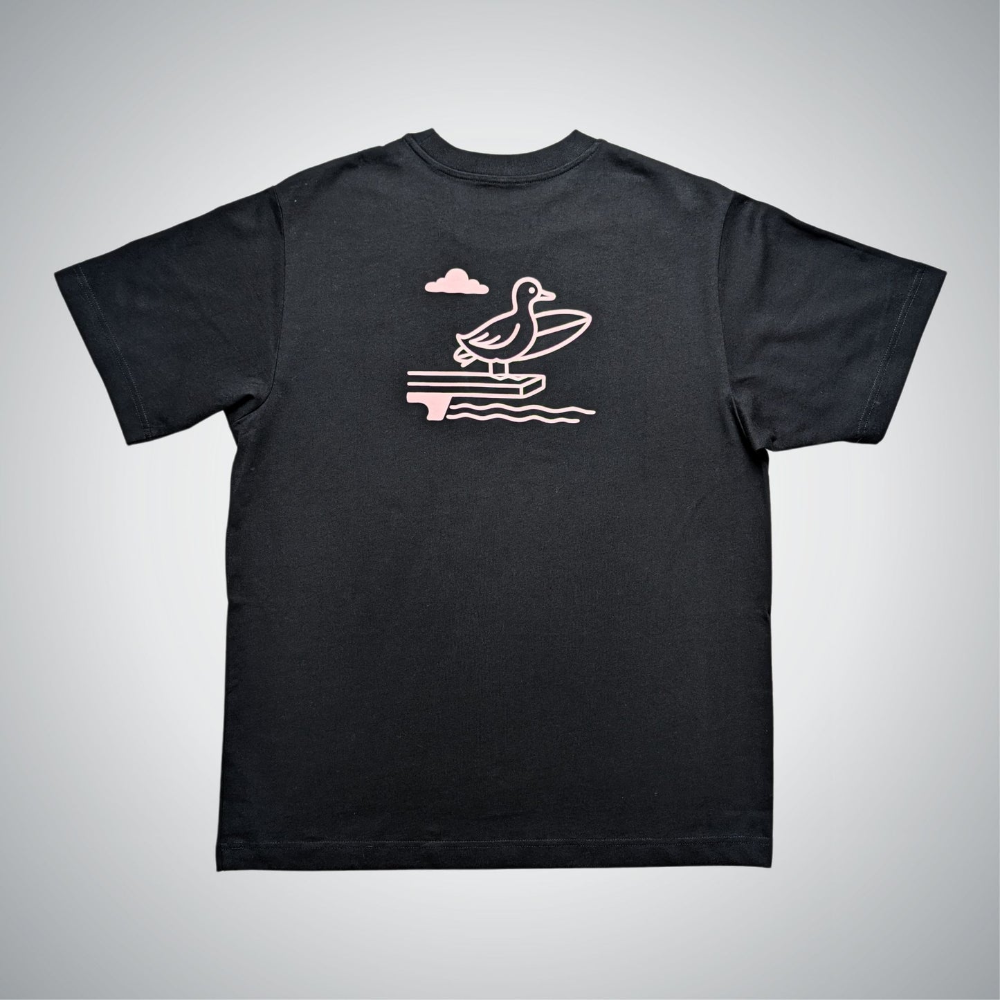 Black t-shirt with a pink graphic of a duck on a jumping board